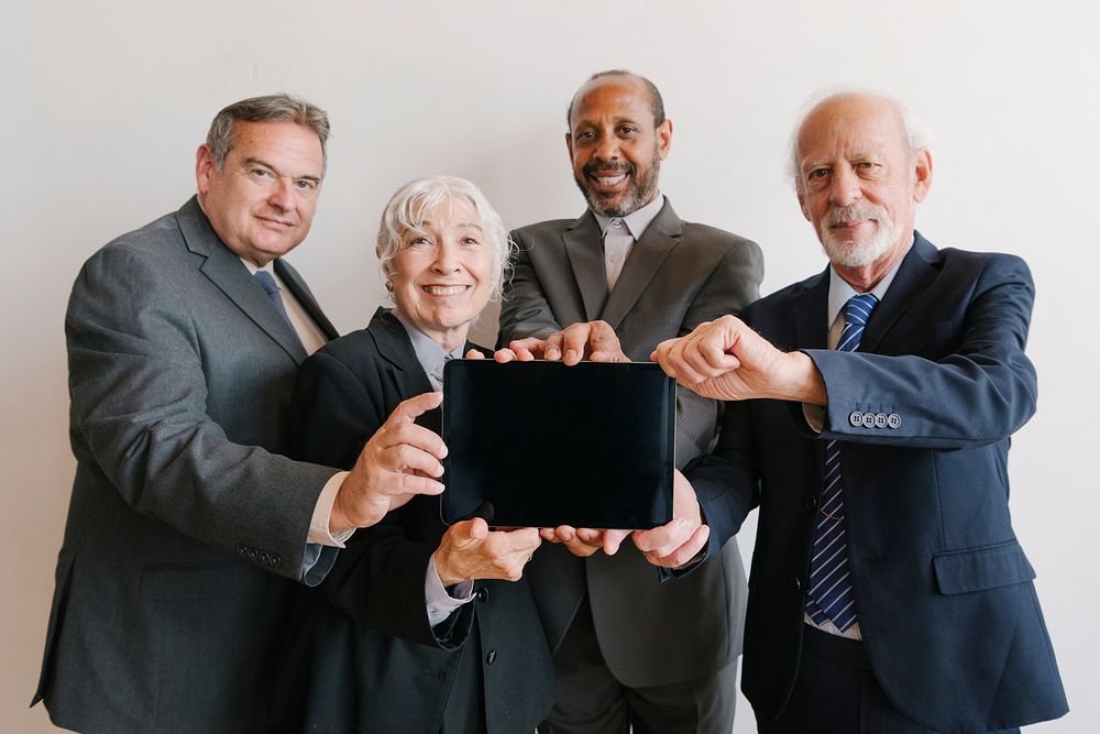 Business people presenting a tablet