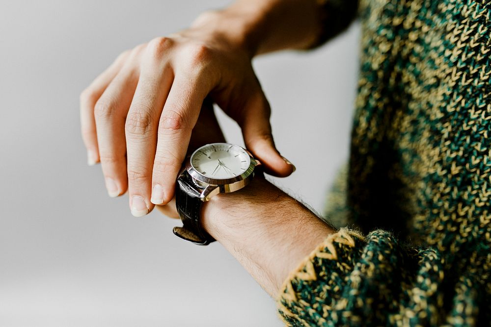 Closeup of a black watch on a wrist