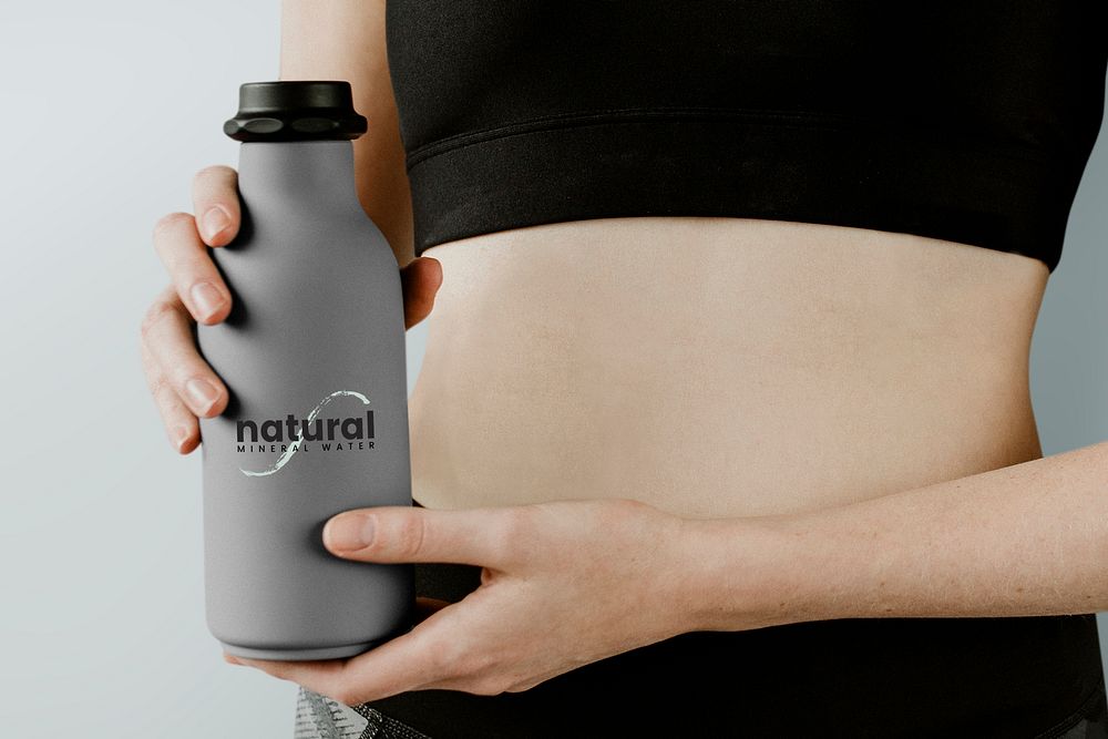 Sportive woman with a water bottle mockup