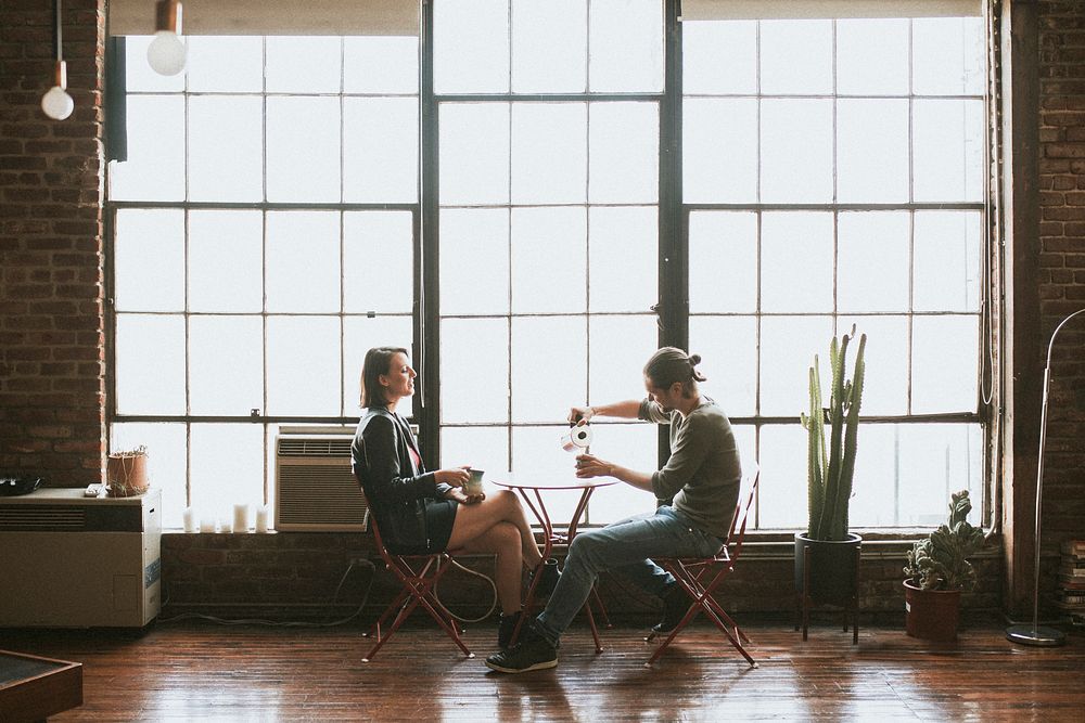 Couple sharing a coffee before off to work