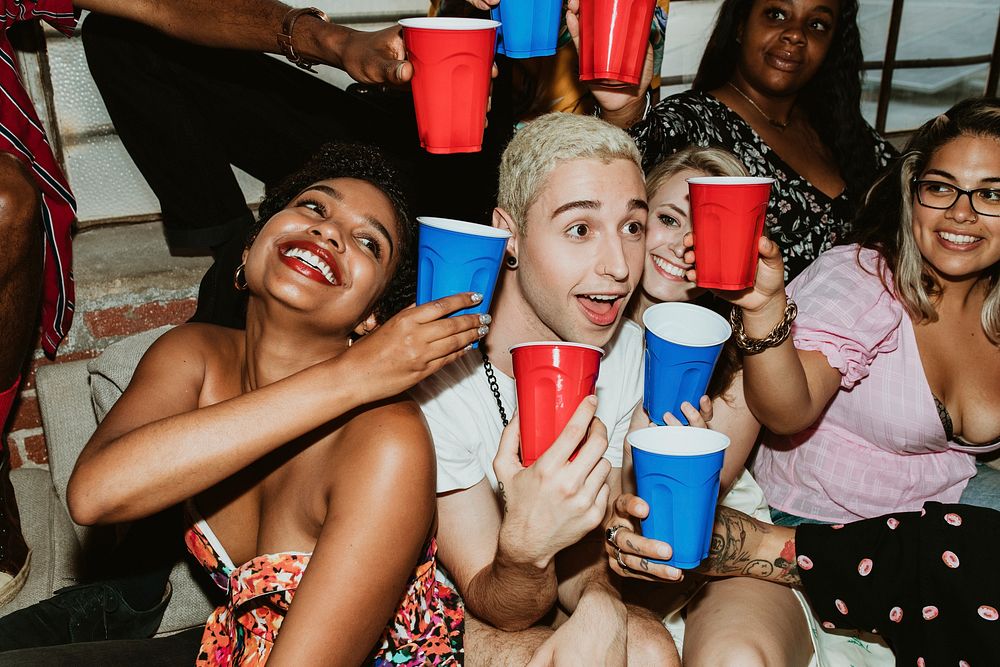 Group of diverse friends toasting at a party