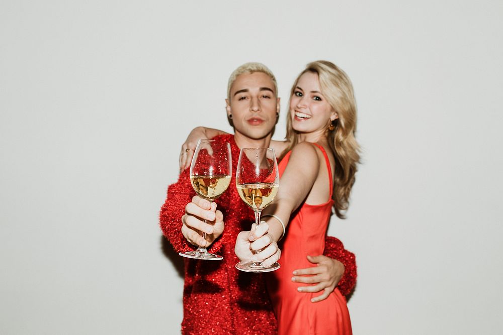 Young stylish couple with white wine