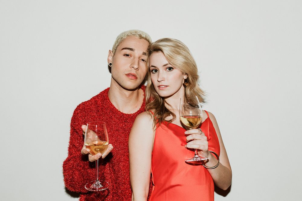 Young stylish couple with white wine