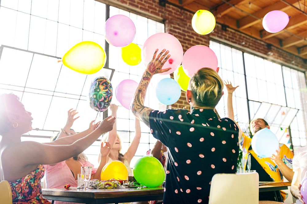 People playing with balloons at a party