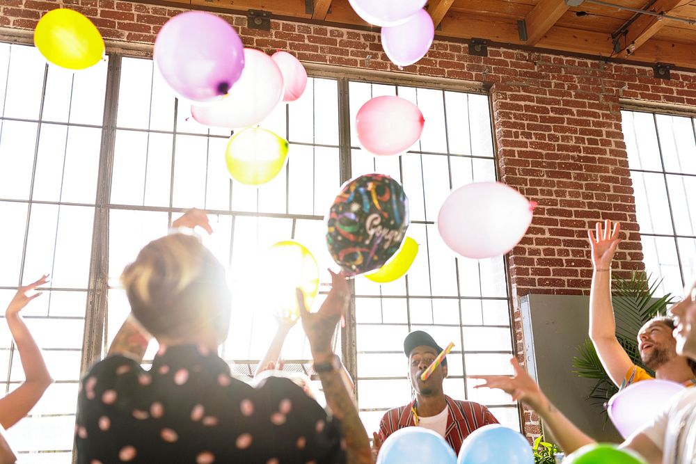 People playing with balloons at a party