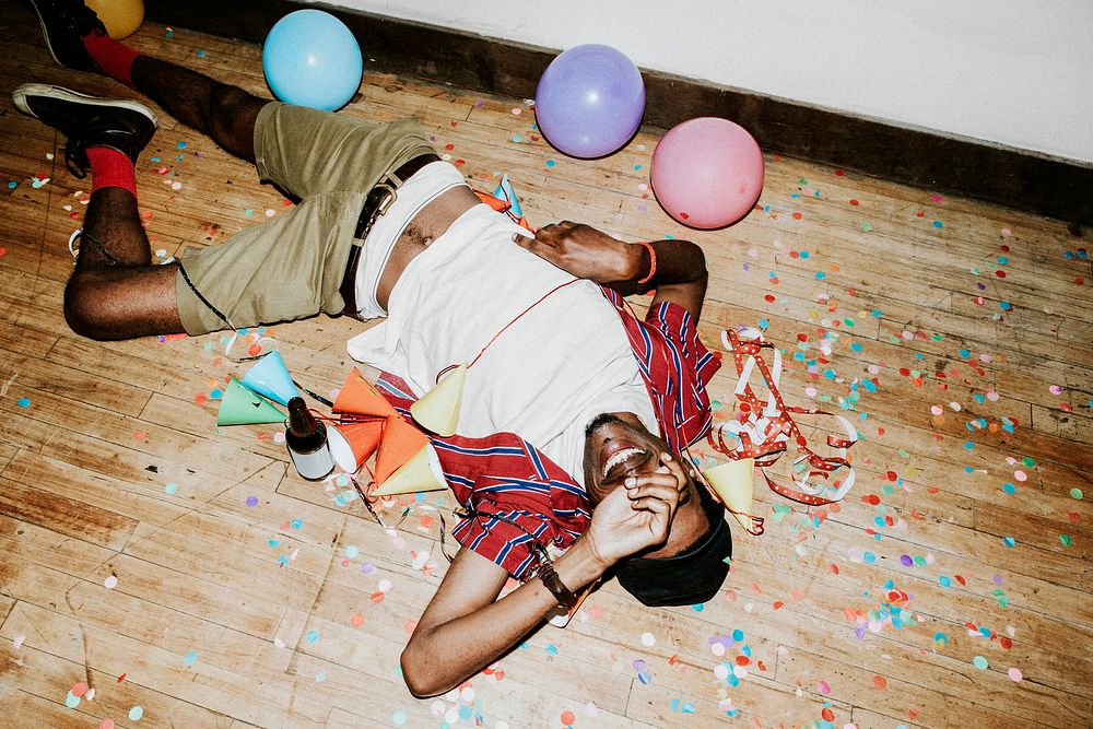 Happy man on the floor at a party