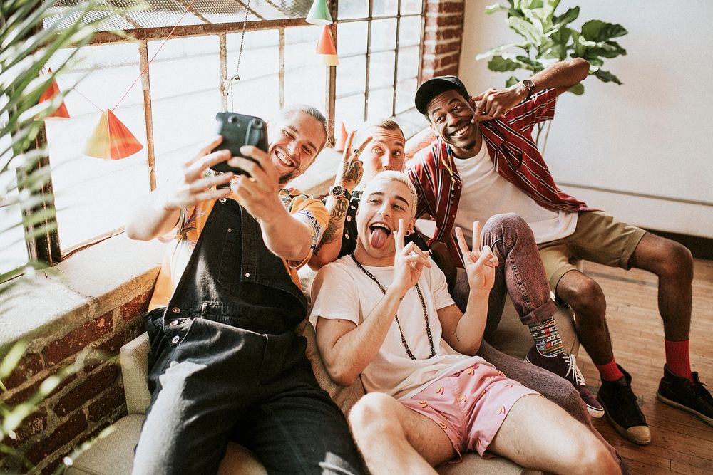 Diverse group of friends taking a selfie at a party