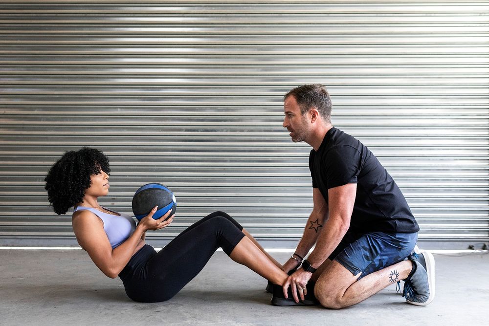 Couple working out with medicine ball