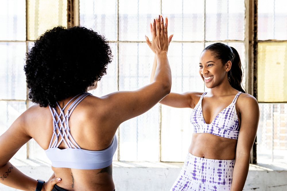 Two sporty women in a gym during a break