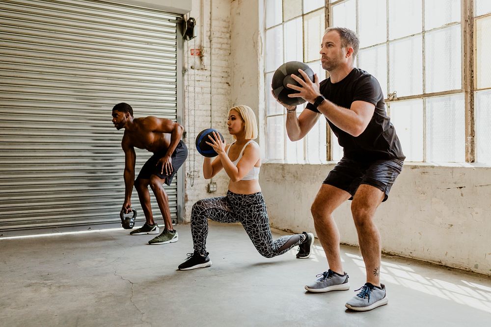 Diverse people working out with fitness balls