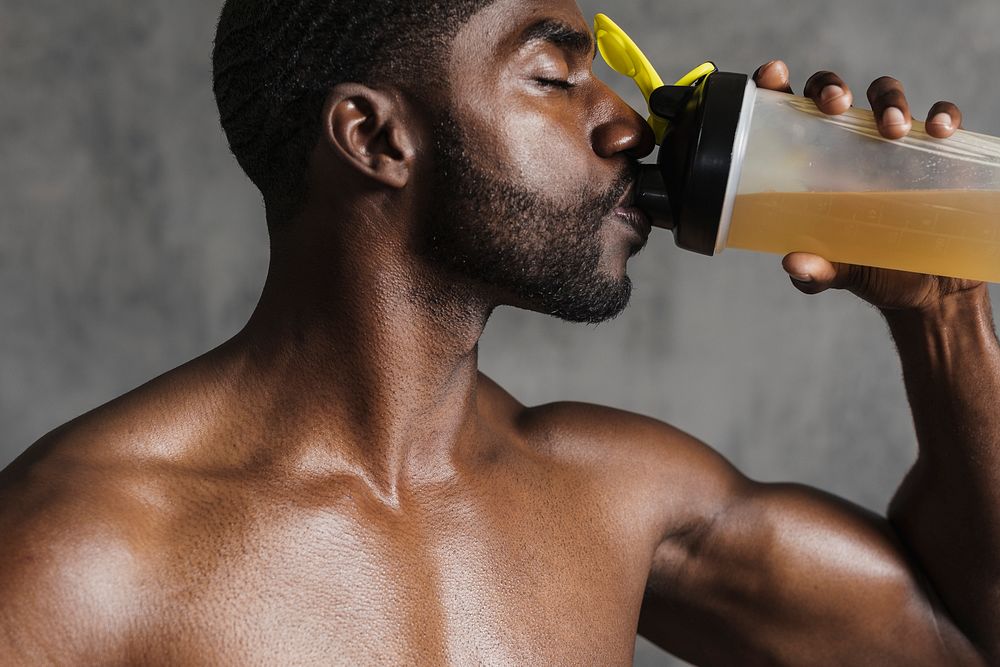 Black man drinking energy drink