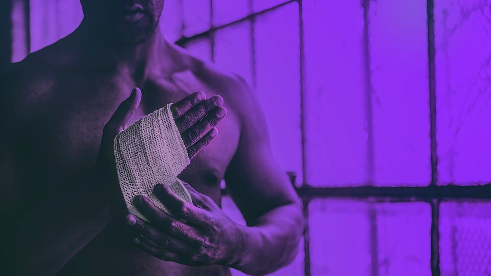 Man wrapping his hand, ready for boxing wallpaper