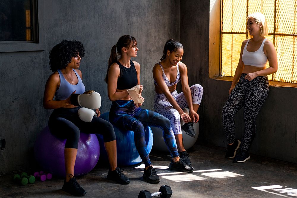Sportive women talking in a gym
