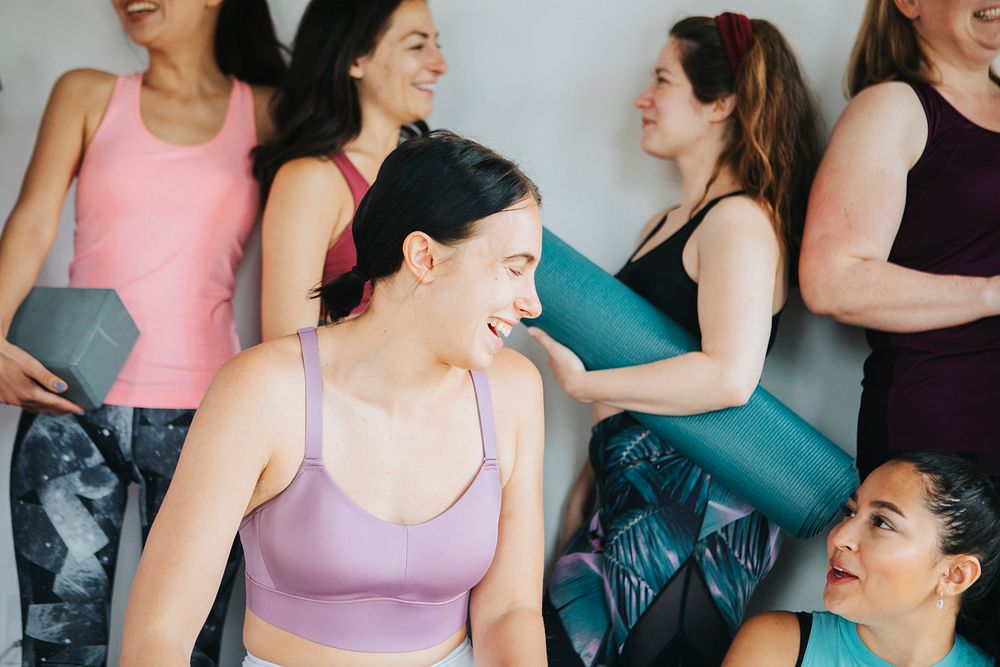 Group of happy friends in yoga class