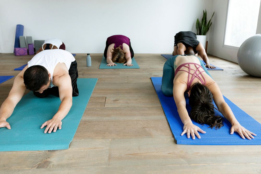 People practicing yoga at a studio