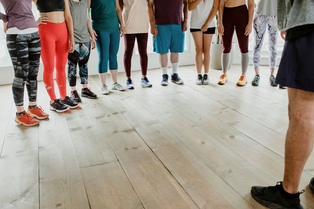 Trainer and his students in a gym