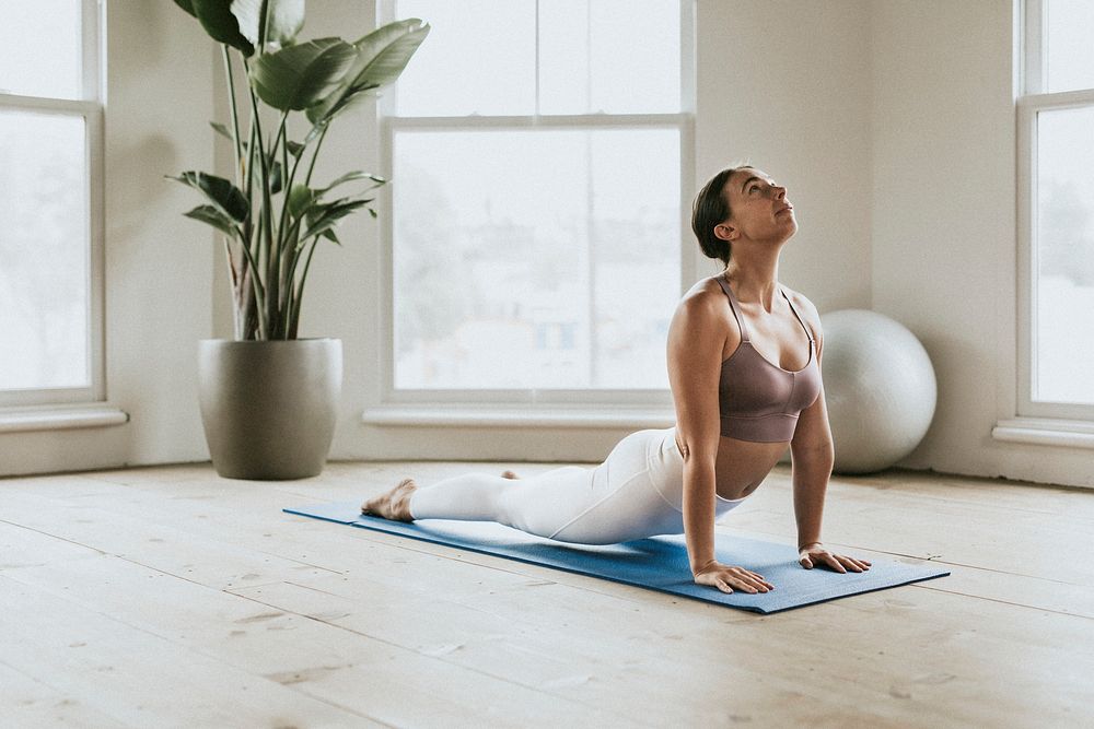 Sportive woman doing a Bhujangasana pose