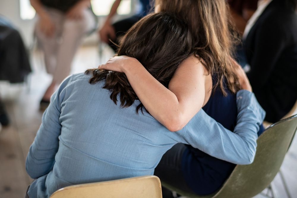 Diverse people in a supporting group session