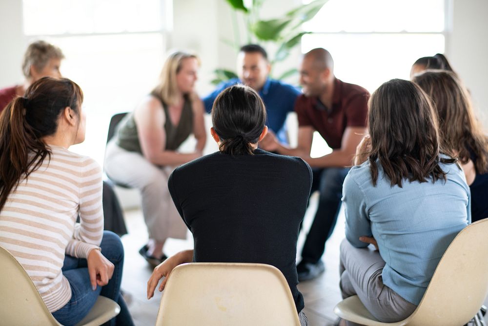 Diverse people in a supporting group session