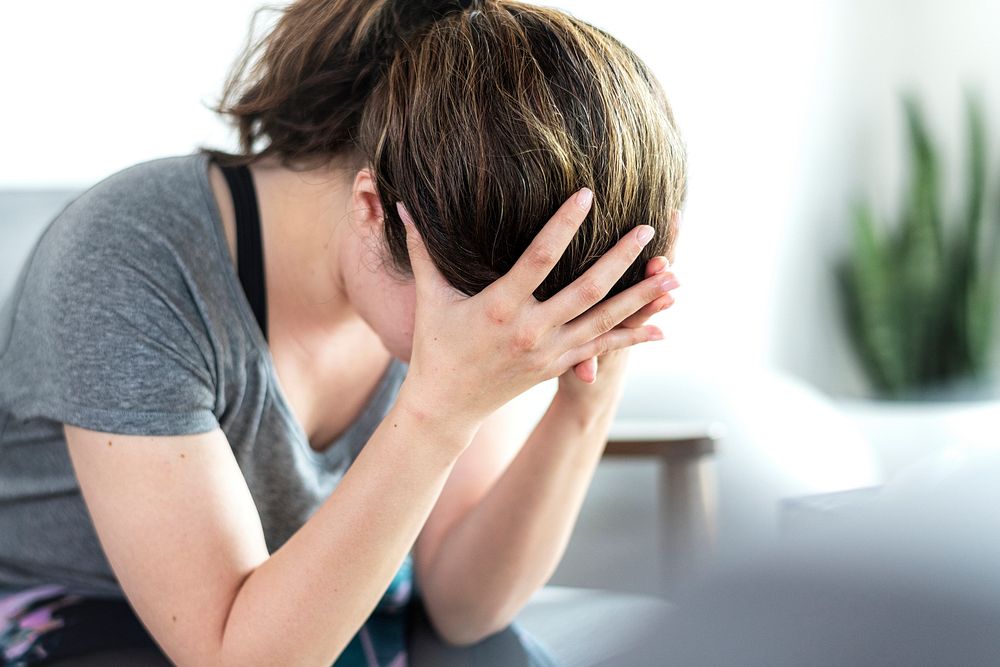 Emotionally stressed woman not feeling well