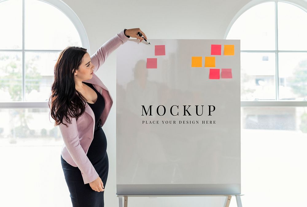 Businesswoman writing on a whiteboard mockup