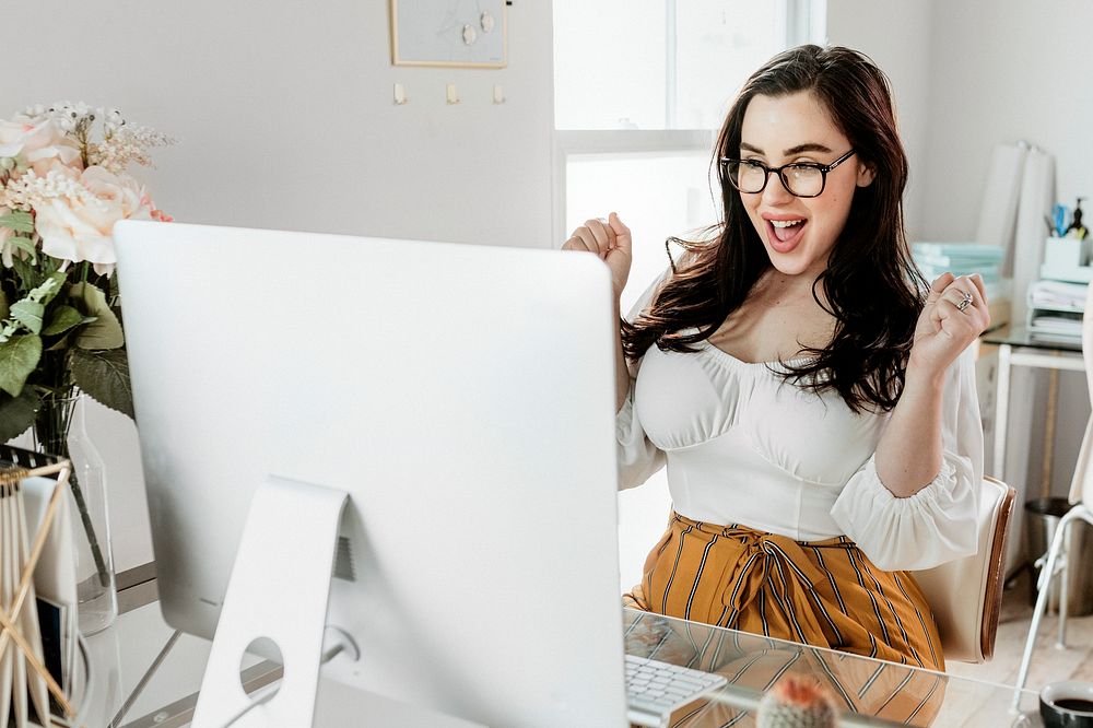 Happy woman working on her computer