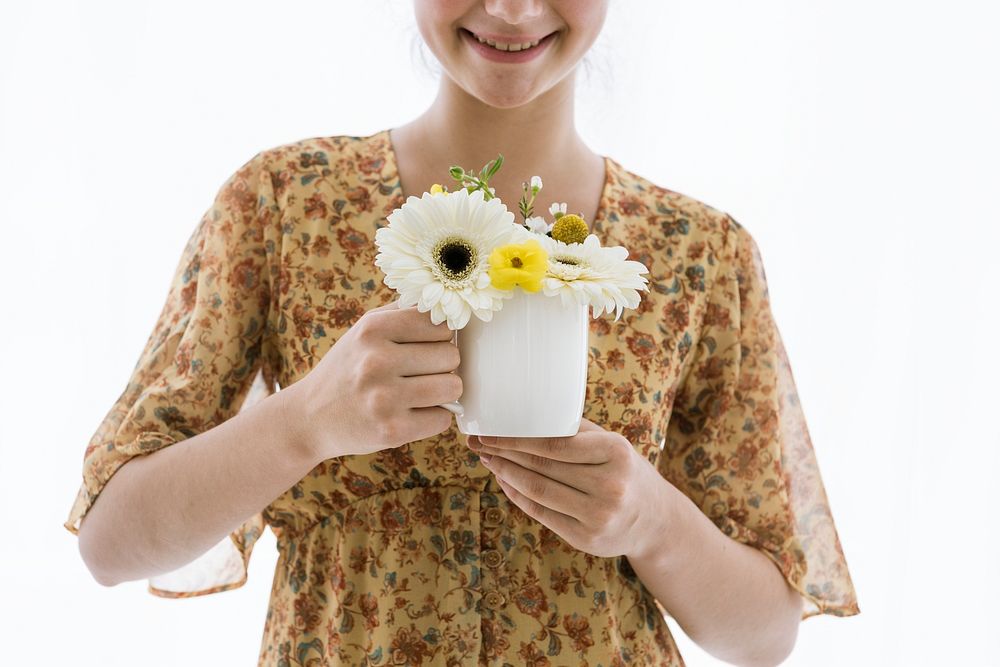 Girl with flowers in her coffee cup