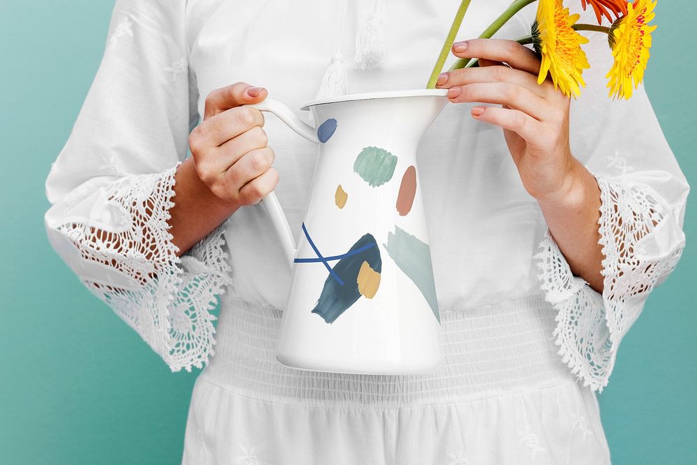 Girl holding a jug mockup with daisies
