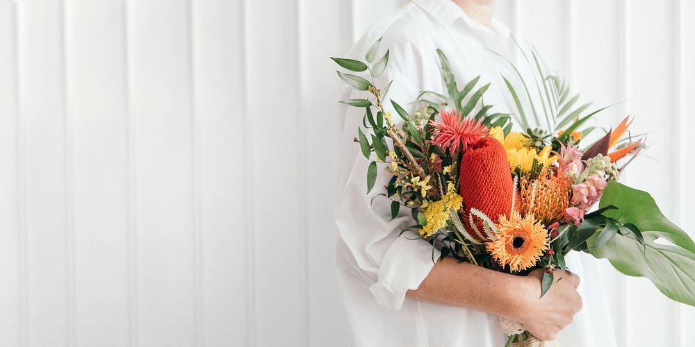 Woman holding a colorful tropical bouquet