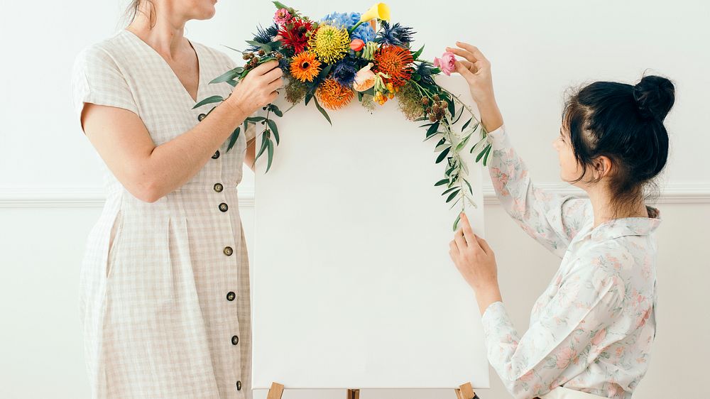 Mother and daughter decorating with flowers