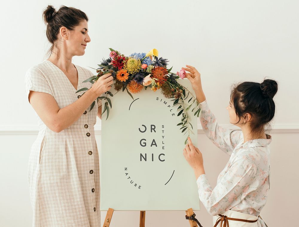 Women standing by a floral organic frame mockup