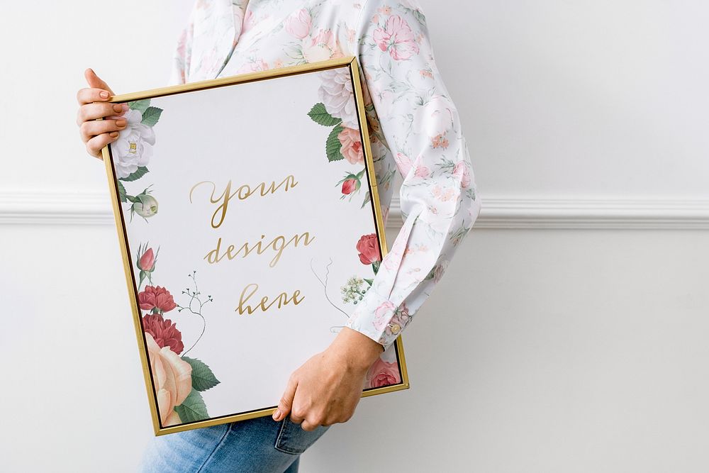 Woman holding a floral frame mockup