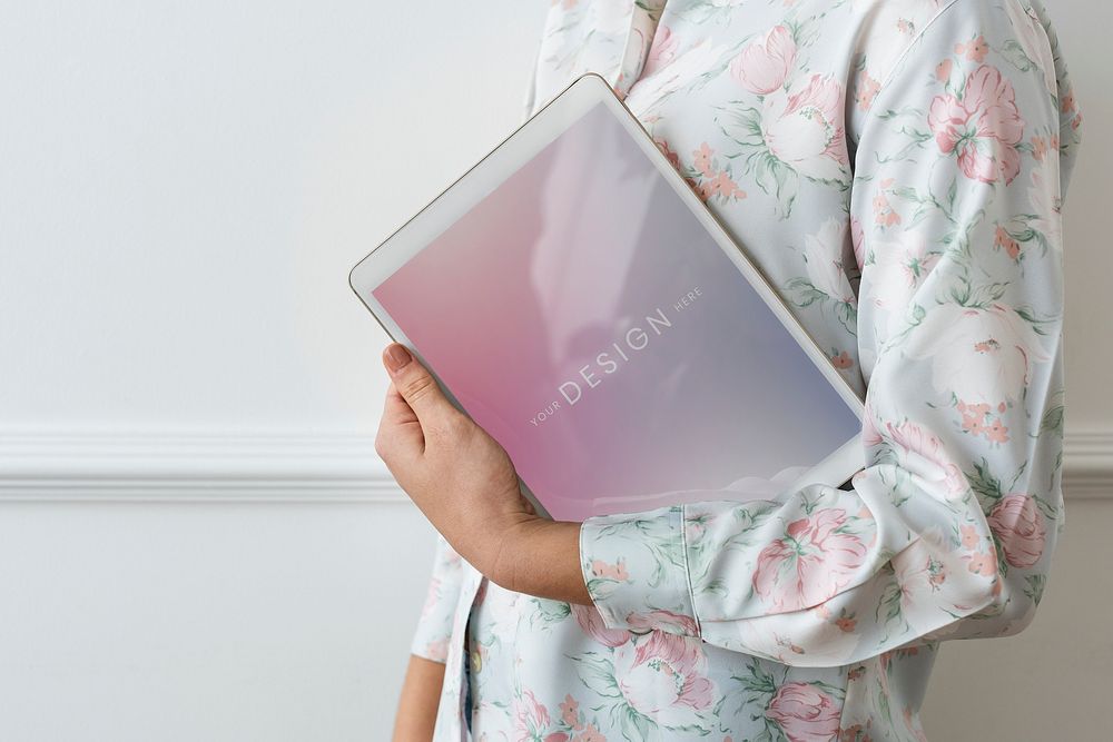 Woman holding a digital tablet mockup