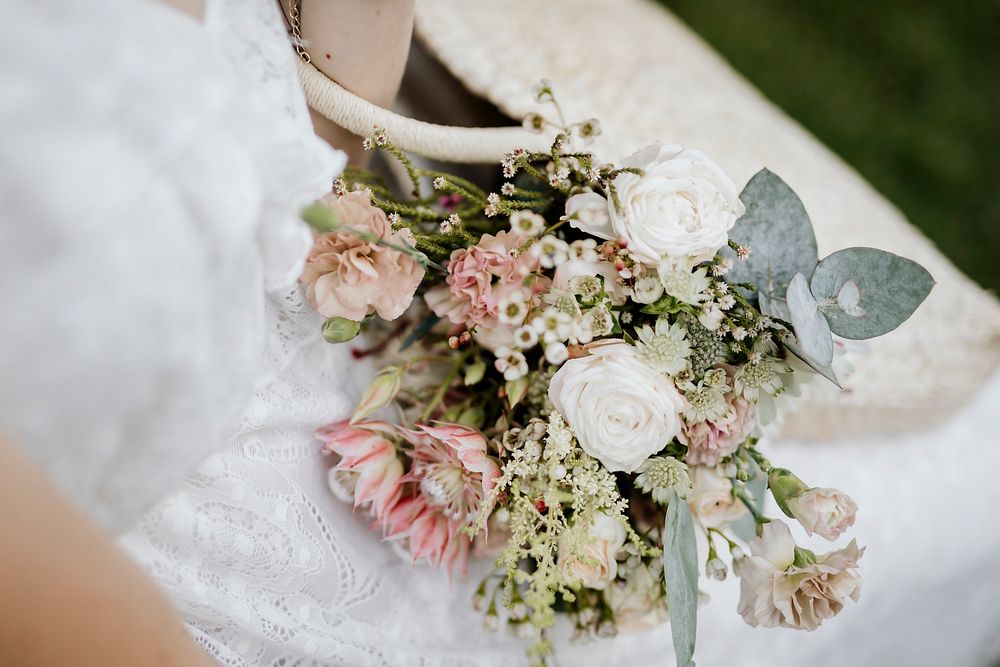 Woman with a woven bag full of flowers