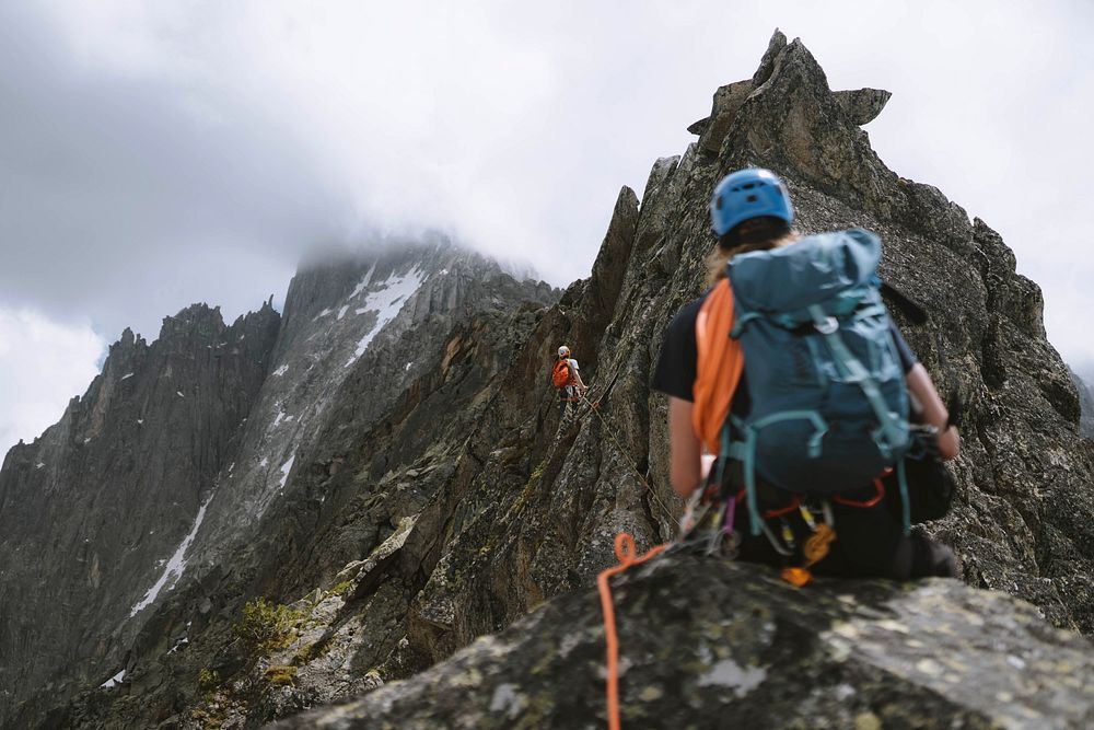 Backpackers zip lining through Chamonix Alps in France