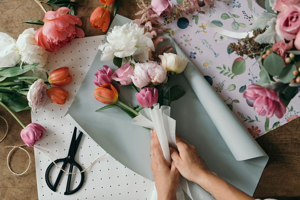 Florist arranging a bouquet of flower