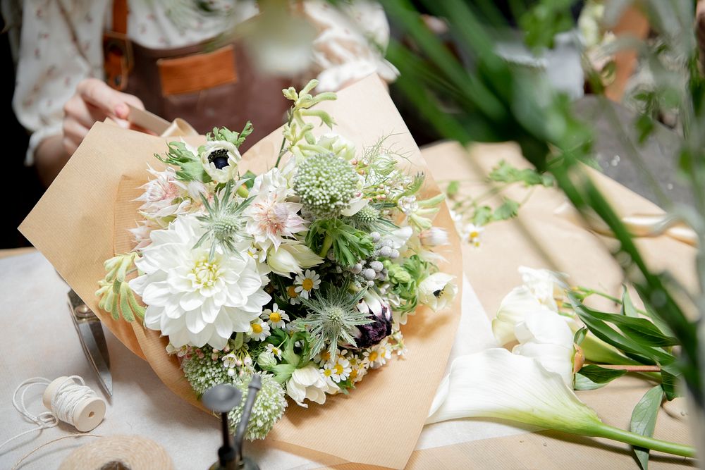 Florist making bouquets at a flower shop