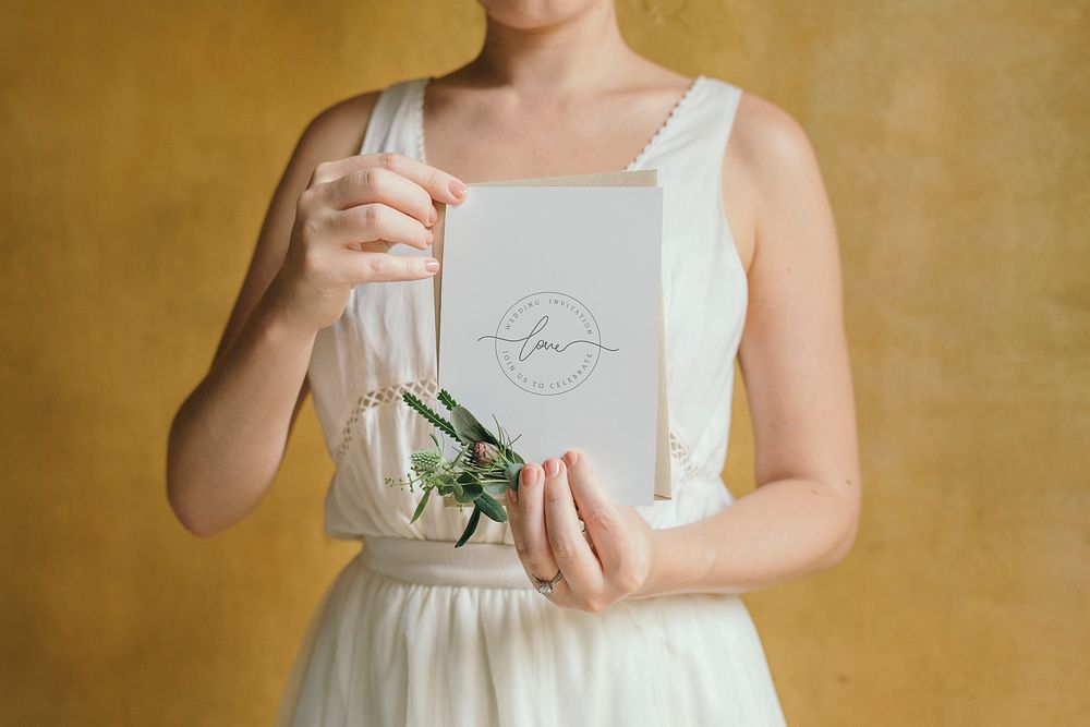 Woman with a wedding invitation card mockup