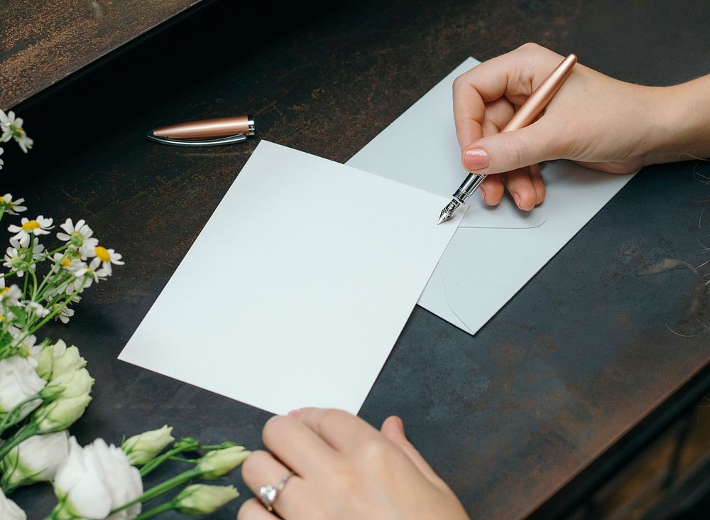 Woman writing on a blank card