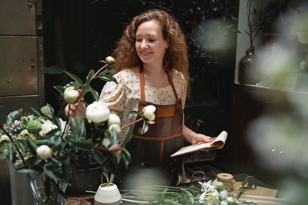 Florist making bouquets at a flower shop