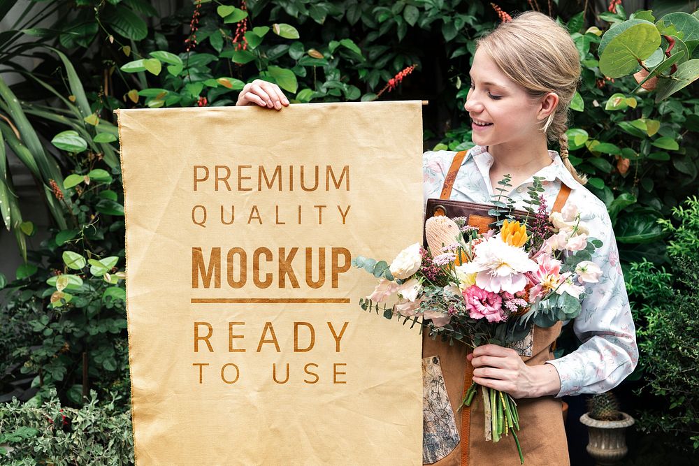 Woman holding a bouquet with a poster mockup