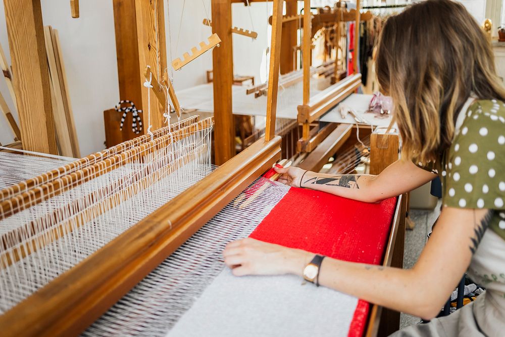 Woman weaving on a loom