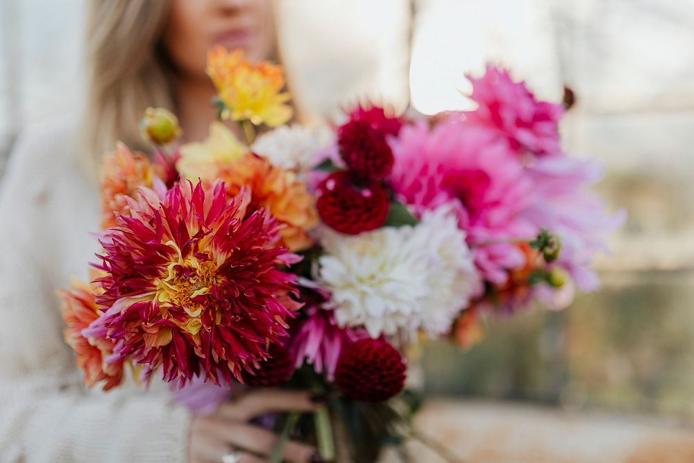 Woman holding a bouquet of beautiful flowers