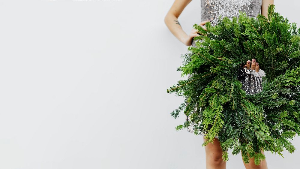 Woman holding a green Christmas wreath template