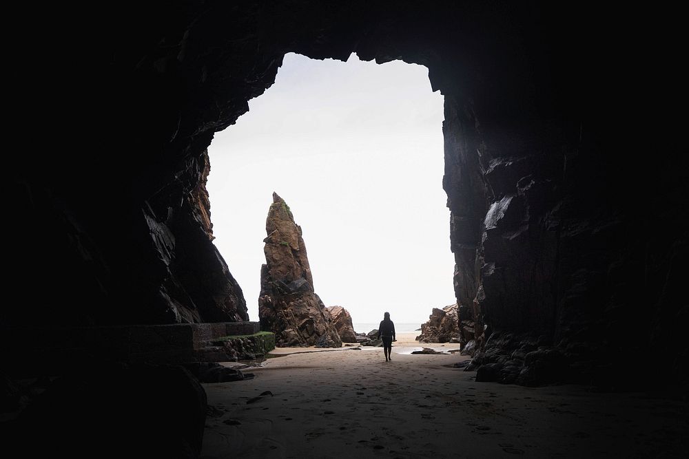 Woman at a cave entrance,  Channel Islands