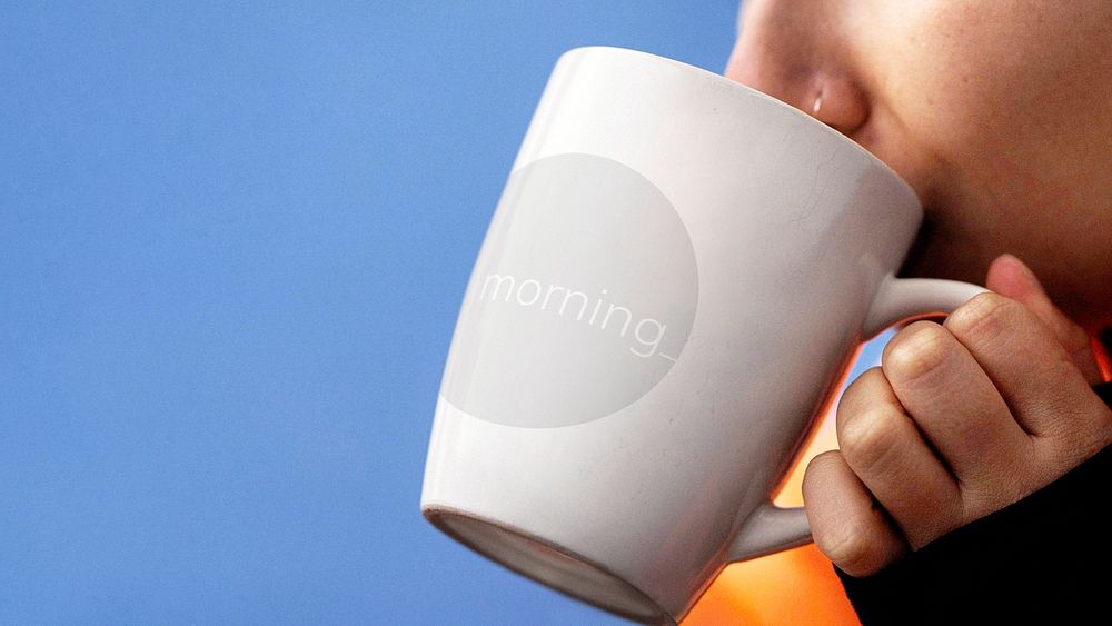 Woman drinking a hot drink out of a mug mockup
