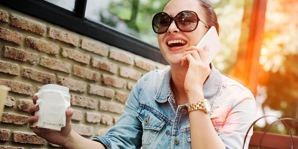 Woman laughing while talking on the phone