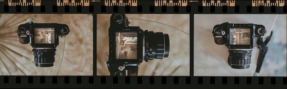 Vintage 35mm film strip with photos of an analog camera