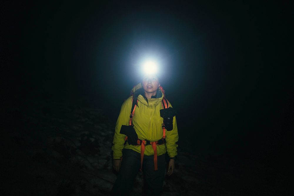 Mountaineer trekking in the cold night at Glen Coe, Scotland