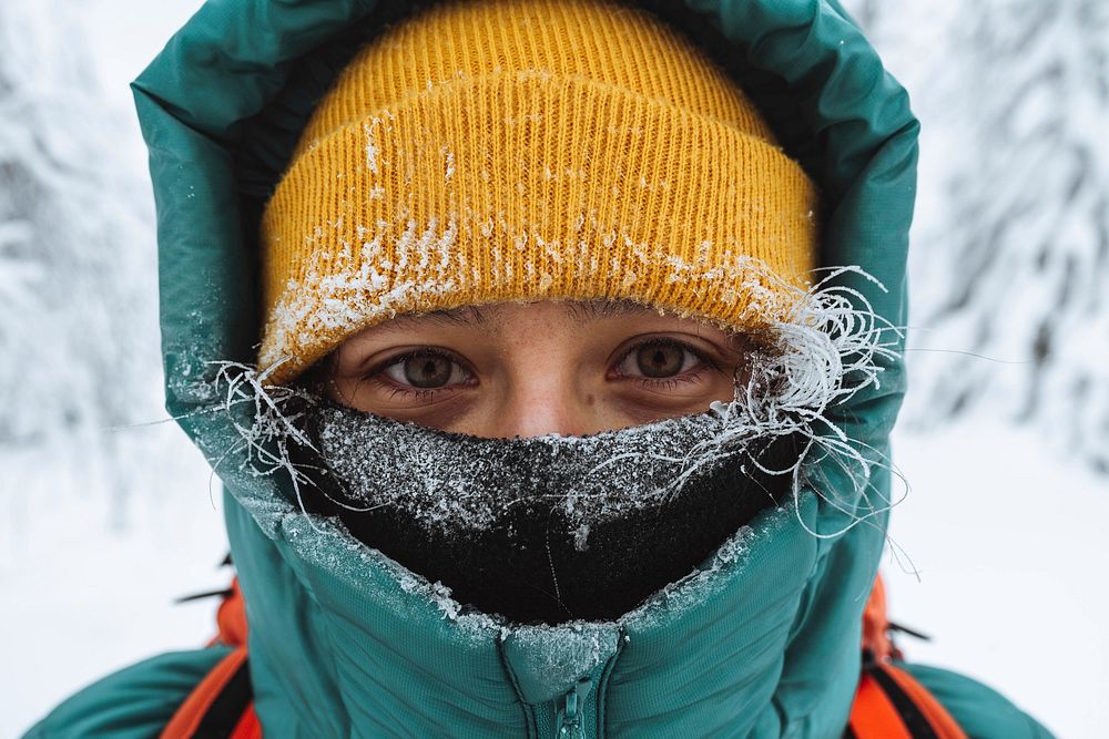 Closeup of female mountaineer in wintertime at Glen Coe, Scotland